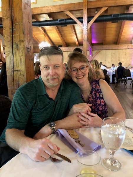A person and person sitting at a tableDescription automatically generated with medium confidence